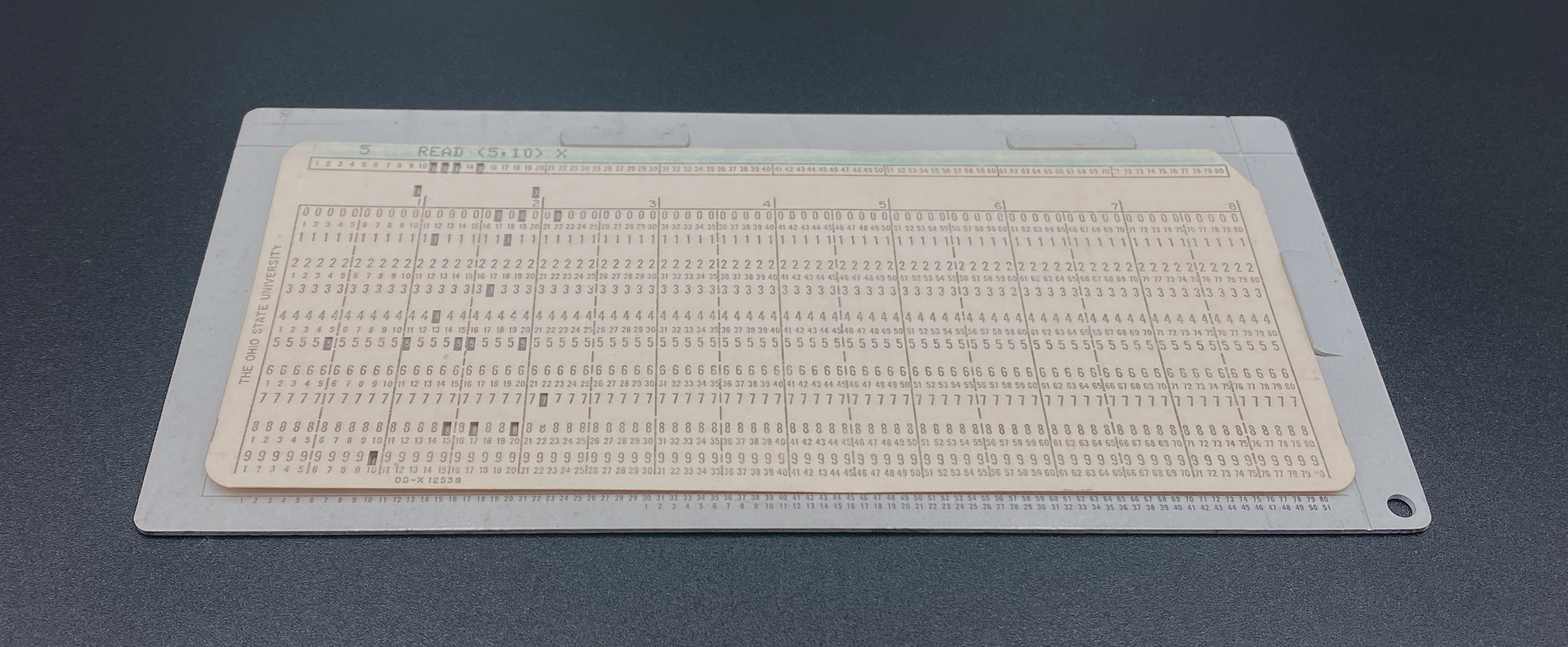 A punched card positioned in the card gauge