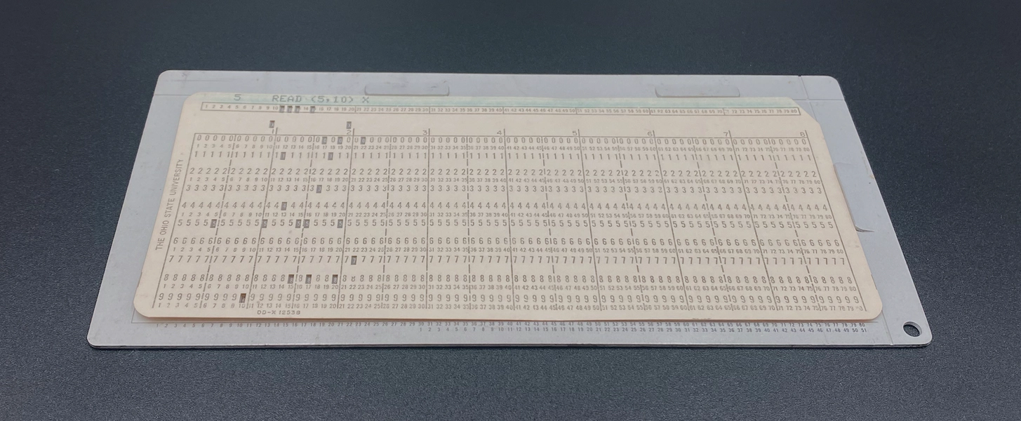 A punched card positioned in the card gauge