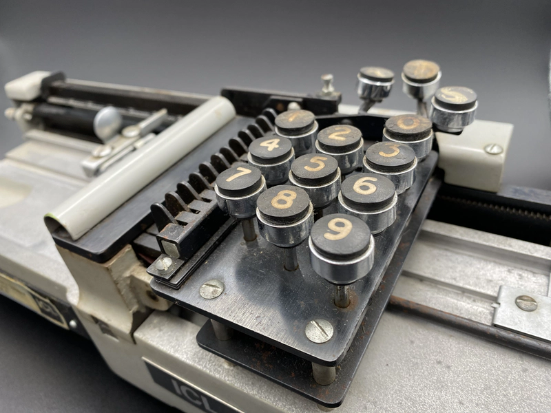 Detail of the card punch showing the keys and punch assembly.