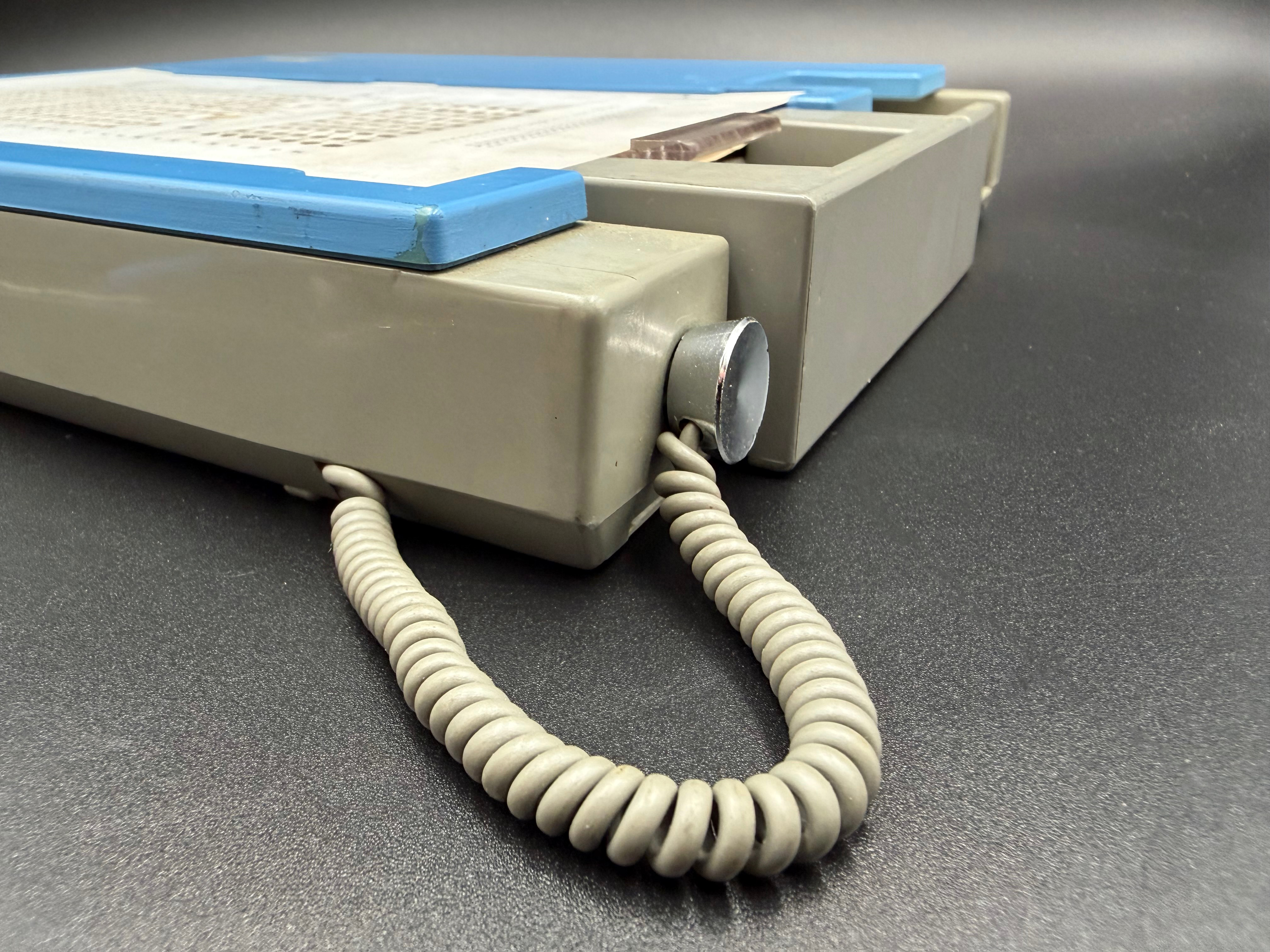 Detail showing the stylus stowed in the side of the unit.