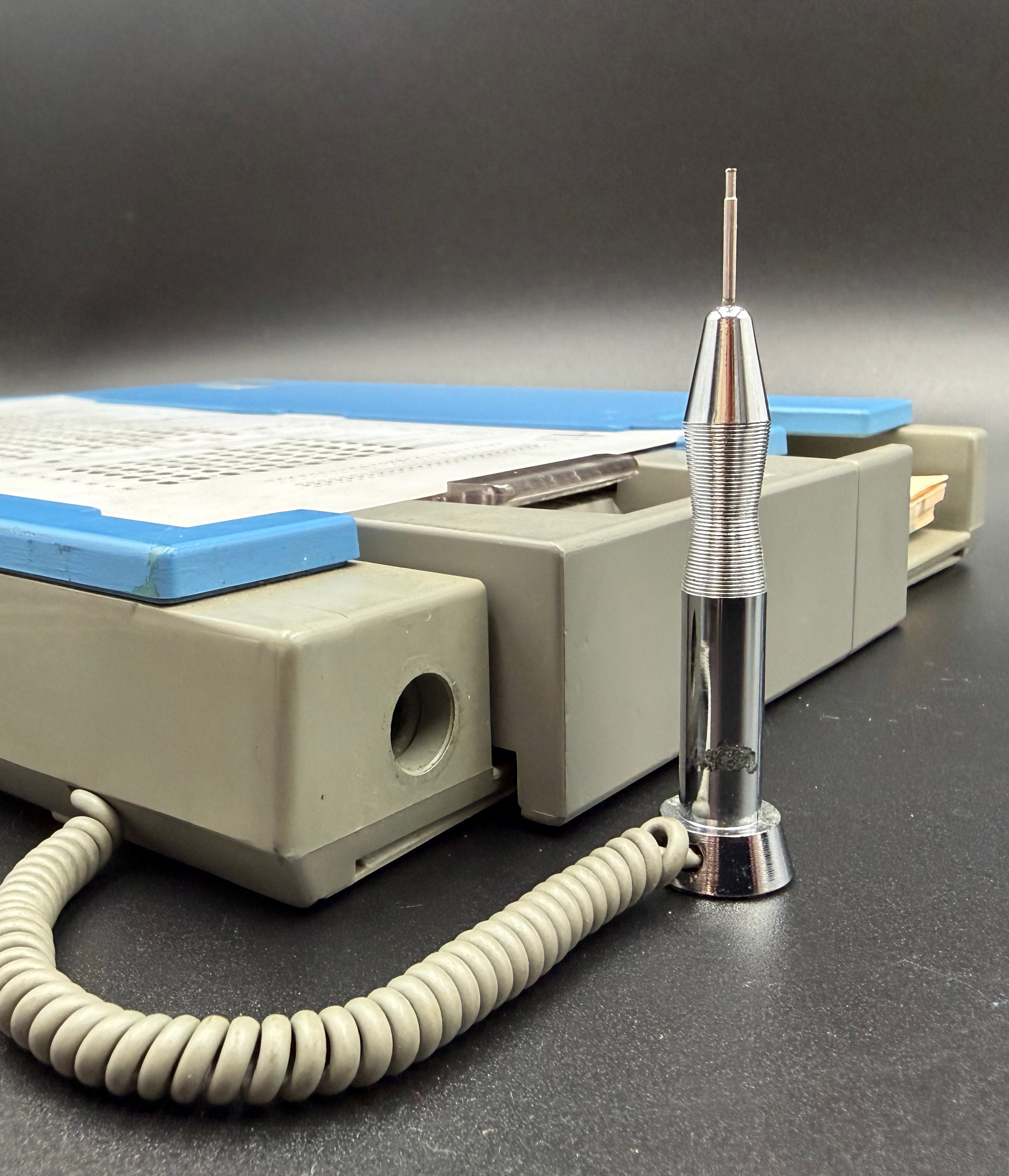 Detail showing the stylus removed from the unit and standing upright.