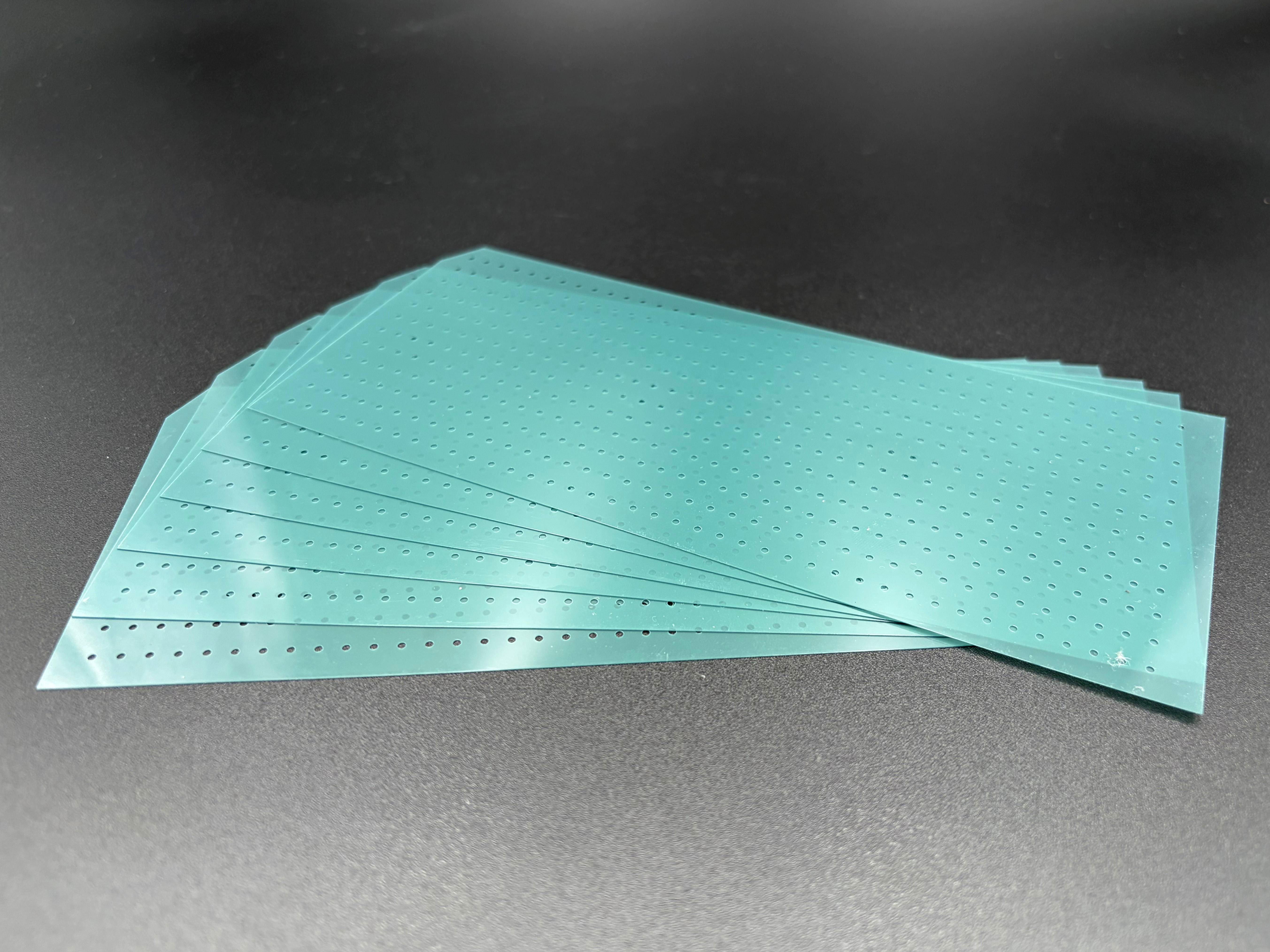 All six remaining punching templates from the envelope, stacked together.