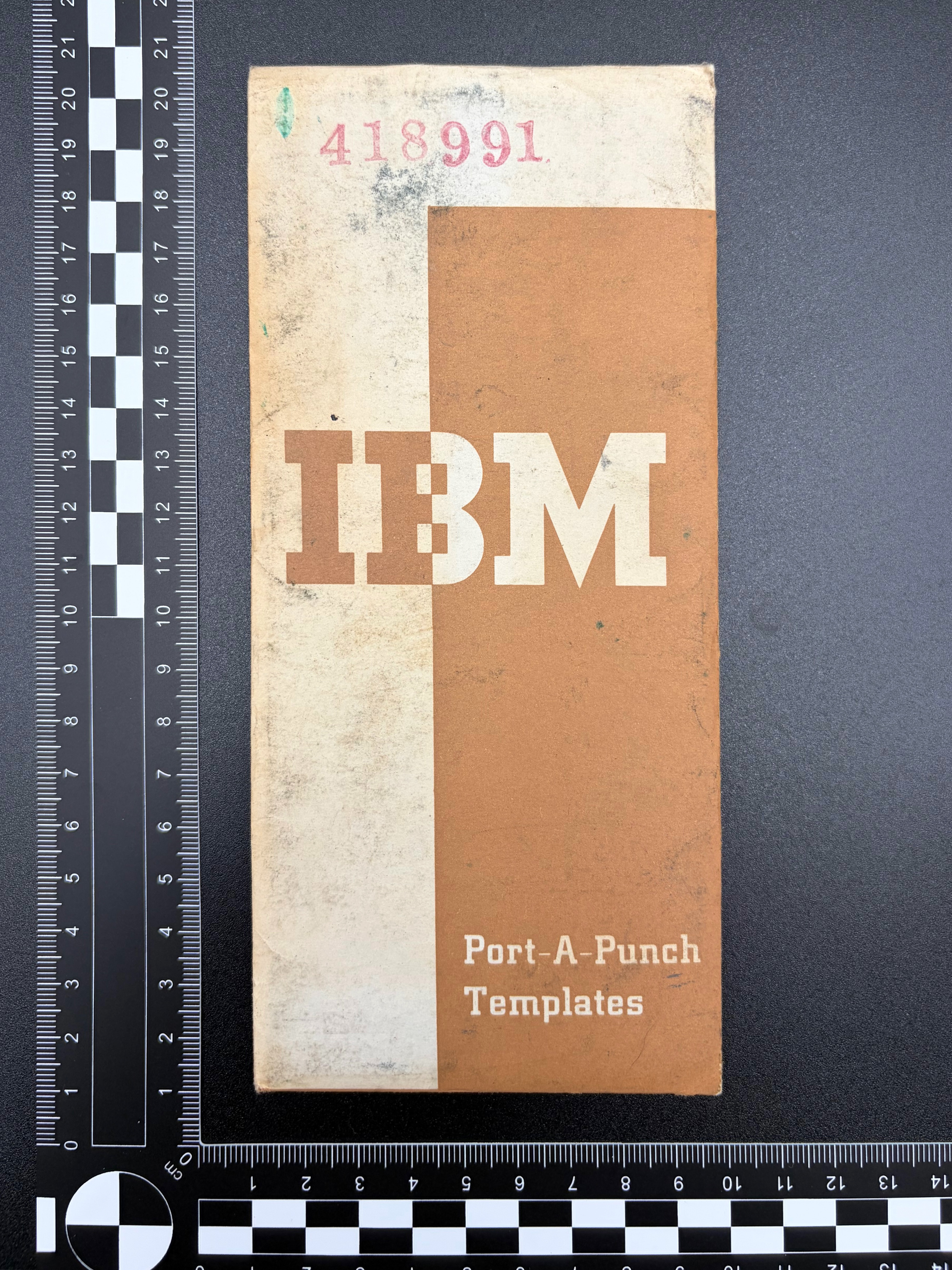 The front of the punching template envelope showing the printed design and text.